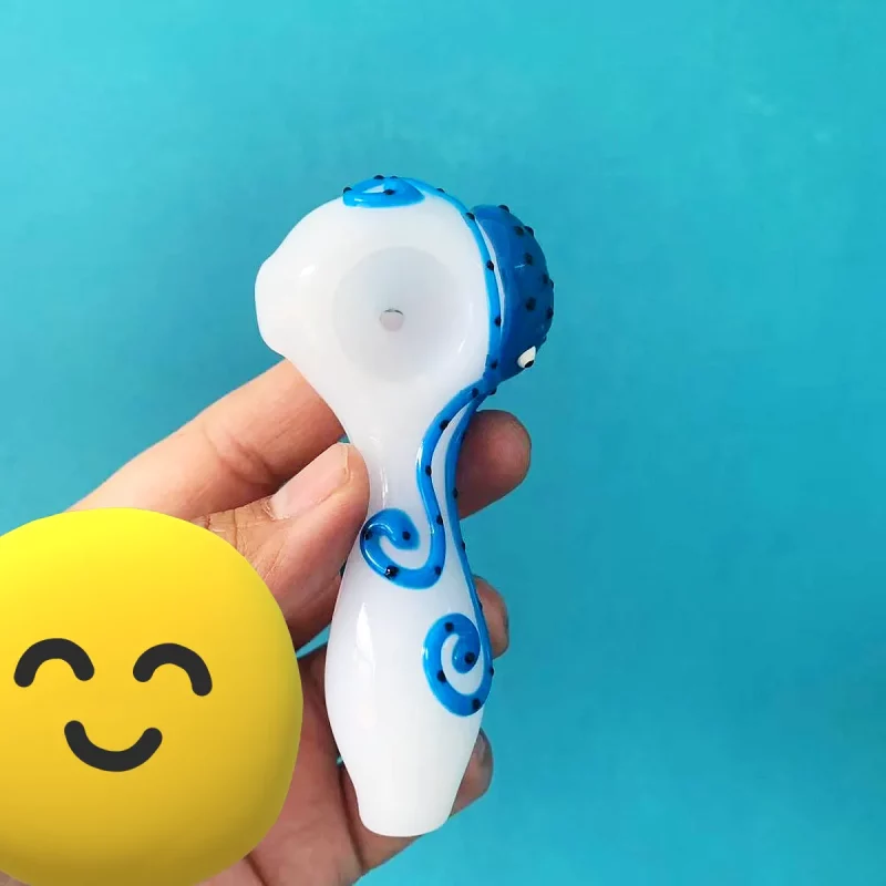 Explore the depths of artistry with our Luminous Hand-Painted Octopus Glass Pipe. Measuring a compact 10cm (approximately 3.9 inches), this unique piece is crafted from premium borosilicate glass, renowned for its exceptional durability and resistance. Each pipe features a captivating, hand-painted octopus design that brings a touch of oceanic wonder to your collection. The intricate details of the octopus, from its intelligent eyes to its gracefully swirling tentacles, are meticulously rendered, making every pipe a miniature work of art. The base color of the pipe provides a beautiful backdrop for the vibrant blue of the octopus, creating a striking contrast that catches the eye. Designed with both aesthetics and comfort in mind, the pipe's ergonomic shape fits perfectly in your hand, offering a secure grip. Its thoughtful construction ensures a smooth and enjoyable experience, making it as practical as it is visually appealing.
