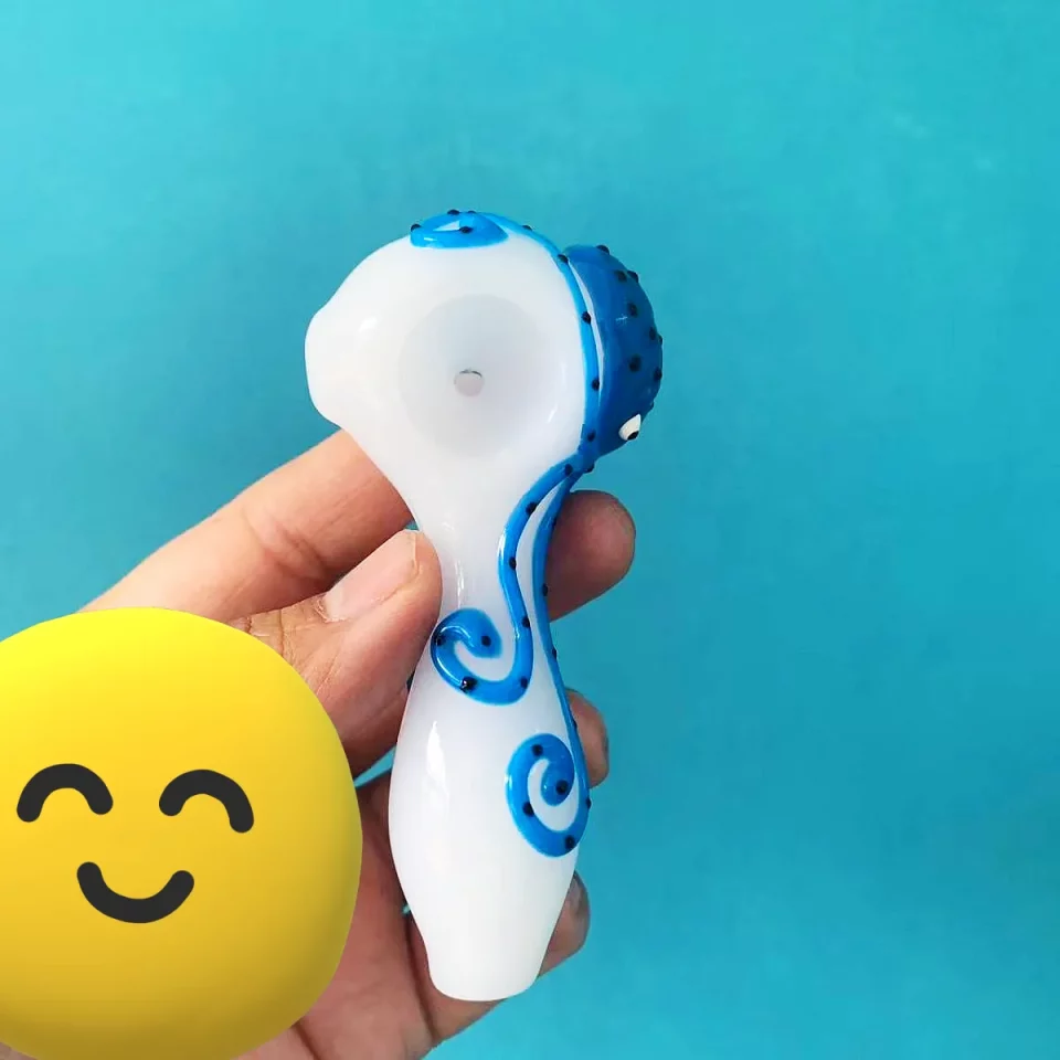 Explore the depths of artistry with our Luminous Hand-Painted Octopus Glass Pipe. Measuring a compact 10cm (approximately 3.9 inches), this unique piece is crafted from premium borosilicate glass, renowned for its exceptional durability and resistance. Each pipe features a captivating, hand-painted octopus design that brings a touch of oceanic wonder to your collection. The intricate details of the octopus, from its intelligent eyes to its gracefully swirling tentacles, are meticulously rendered, making every pipe a miniature work of art. The base color of the pipe provides a beautiful backdrop for the vibrant blue of the octopus, creating a striking contrast that catches the eye. Designed with both aesthetics and comfort in mind, the pipe's ergonomic shape fits perfectly in your hand, offering a secure grip. Its thoughtful construction ensures a smooth and enjoyable experience, making it as practical as it is visually appealing.