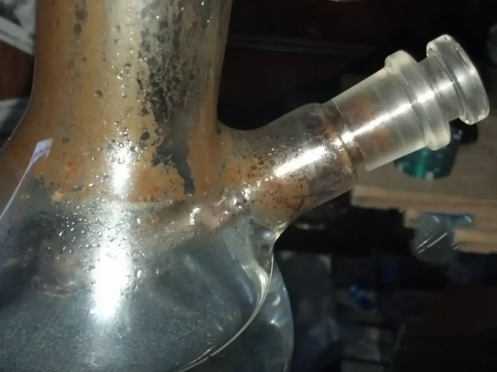 Gently wiggle the stuck downstem left and right to remove it. 