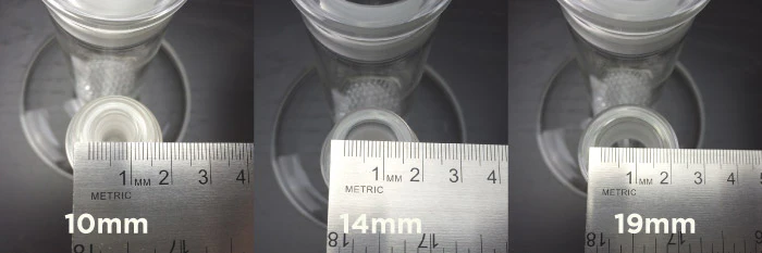 Using a ruler to measure the inner diameter of a bong’s female joint—excluding glass thickness